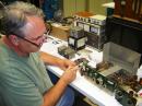 ARRL Lab volunteer Pete Turbide, W1PT, spiffs up a DeMaw receiver. 